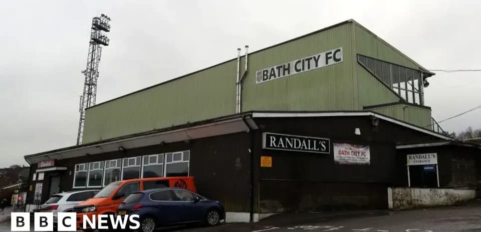 Bath City FC stadium exterior with cars parked