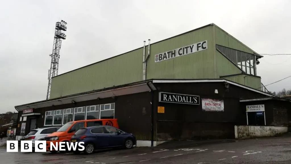 Bath City FC stadium exterior with cars parked