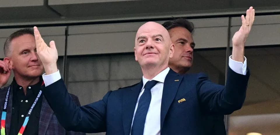 FIFA president gesturing during event with officials