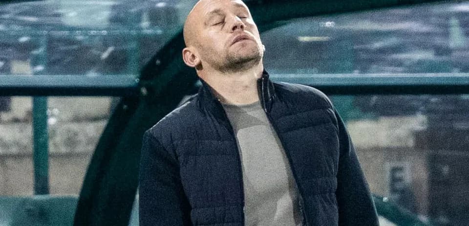 Coach observing match from the sidelines