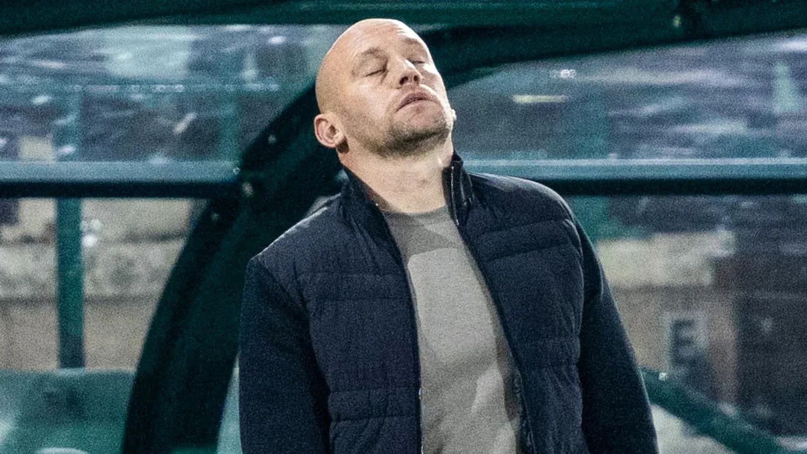 Coach observing match from the sidelines