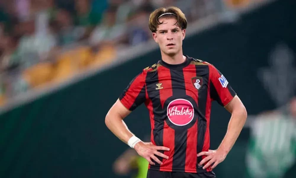 Player in Bournemouth kit standing on the field