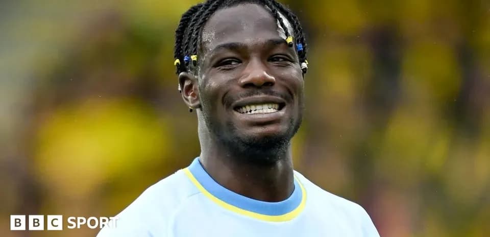 Player smiling during a match warm-up session