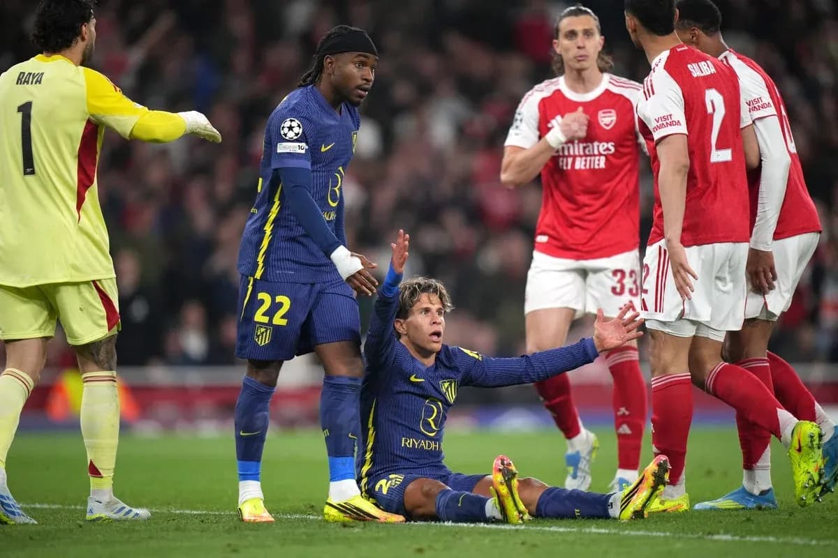 Player on the ground during match, teammates nearby