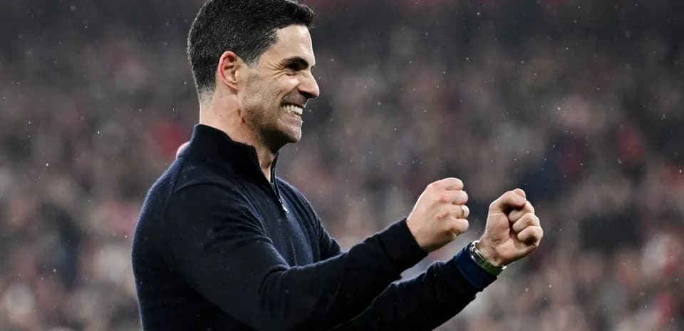 Manager celebrating a victory with clenched fists