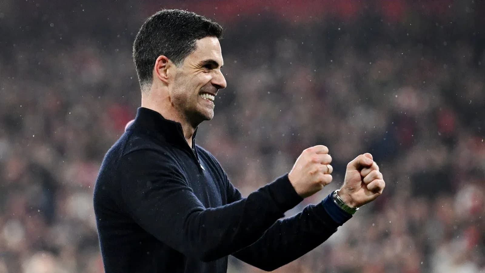 Manager celebrating a victory with clenched fists