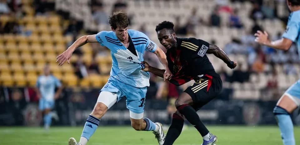 Atlanta United II player tackling Chattanooga opponent