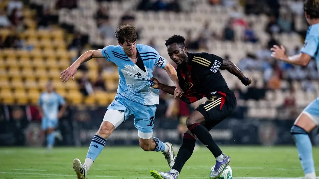 Atlanta United II player tackling Chattanooga opponent