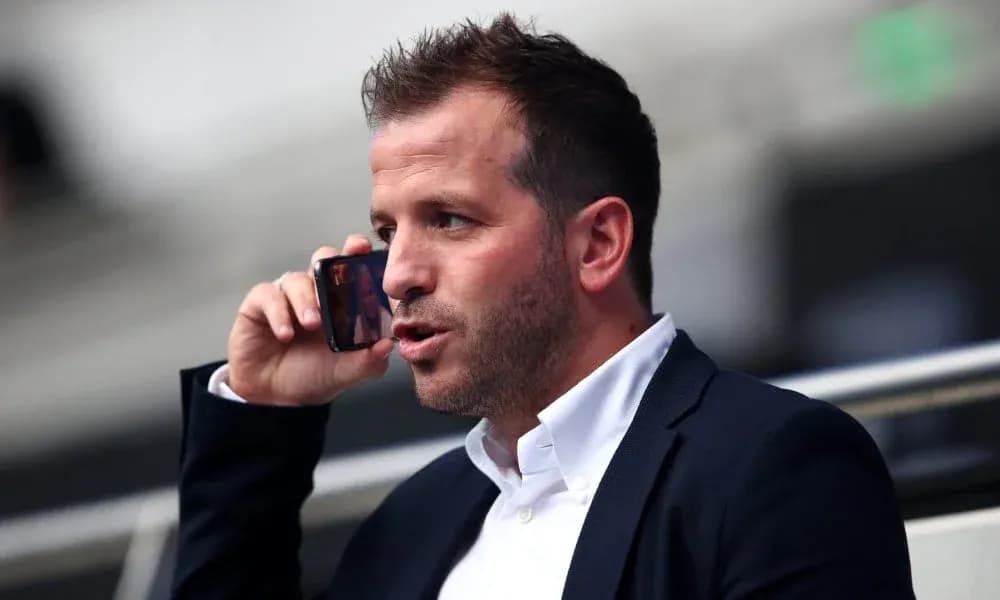 Man talking on the phone in a stadium