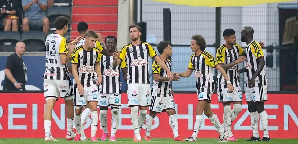 Team celebrating a goal on the field