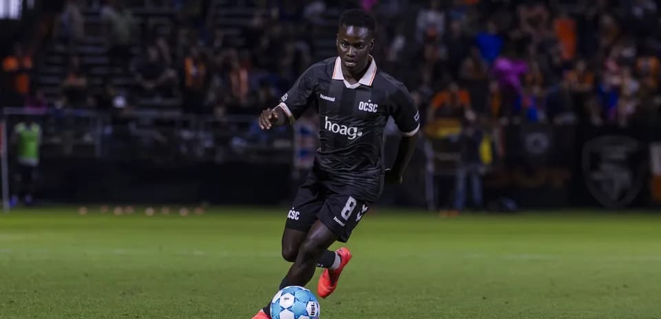 Player dribbling the ball during USL Championship match