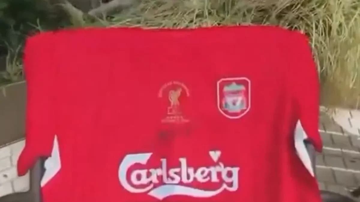 Liverpool jersey with Carlsberg logo displayed outdoors