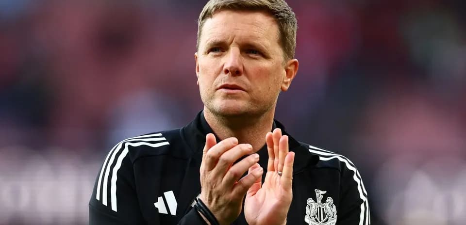 Manager clapping during match at stadium