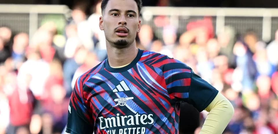 Goalkeeper wearing colorful jersey during match warm-up