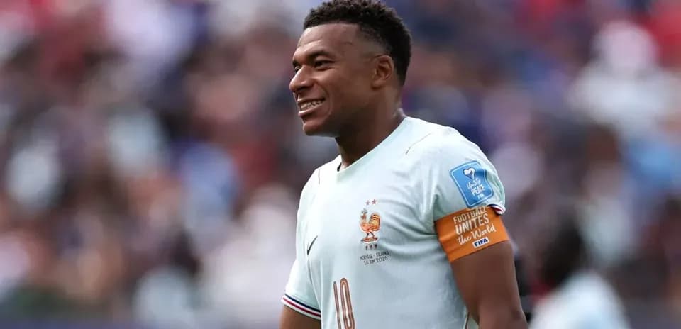 Kylian Mbappé smiling during a match for France