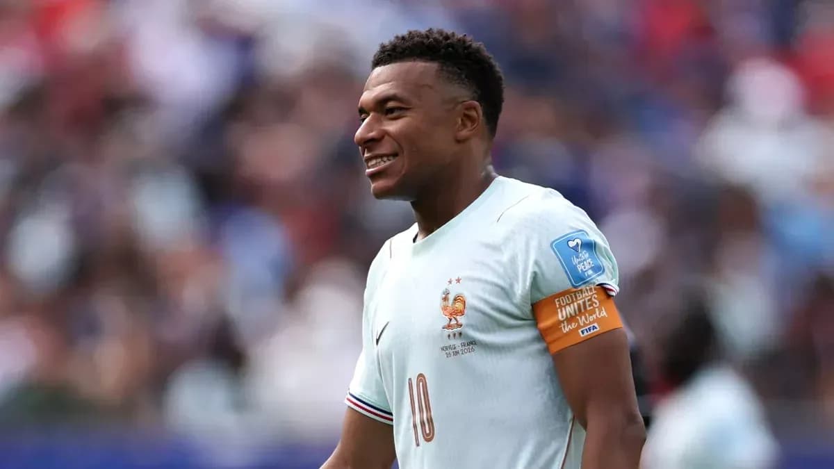 Kylian Mbappé smiling during a match for France