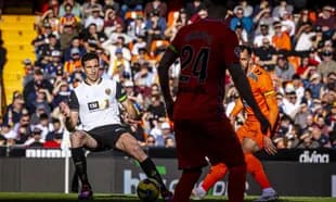 Valencia player preparing to pass the ball