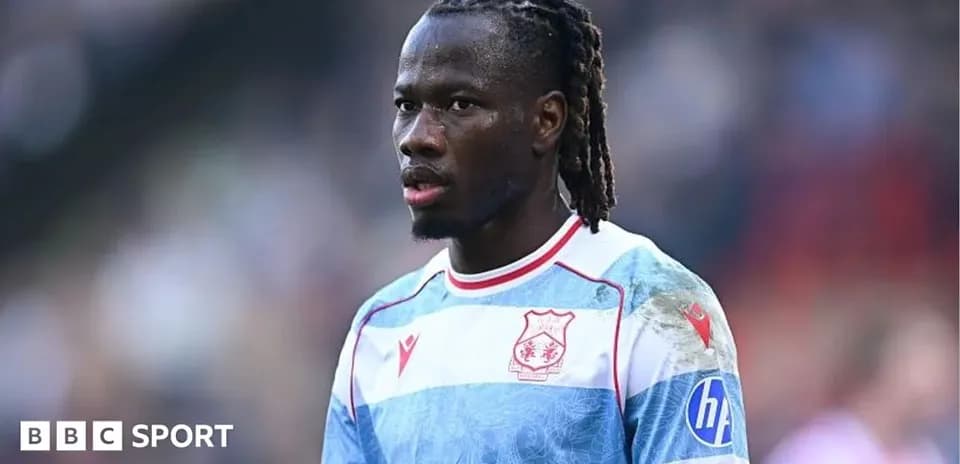 Player in striped jersey during match