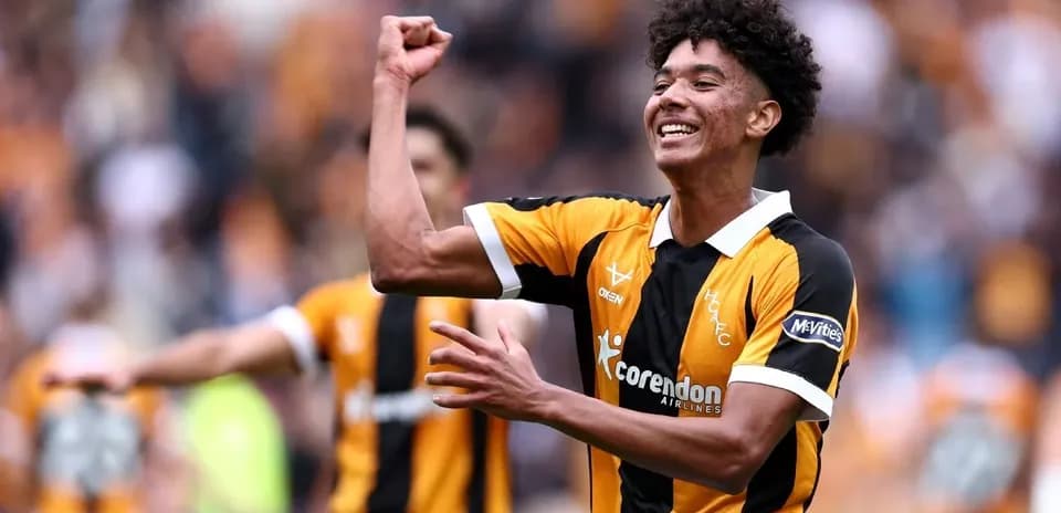 Player celebrating a goal on the pitch