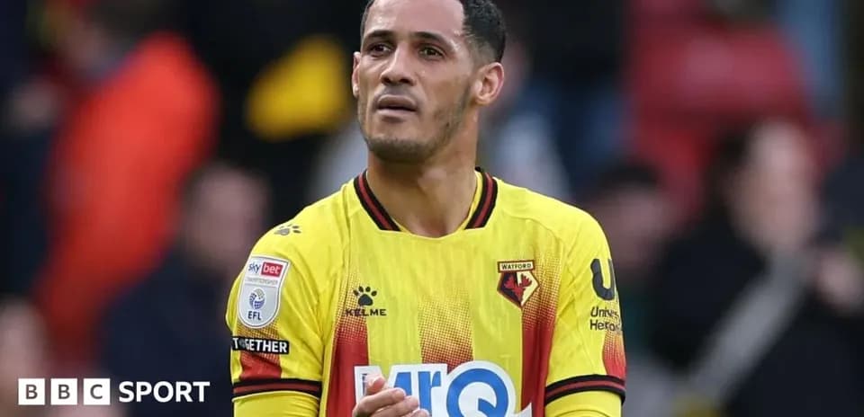 Watford player applauding fans after match
