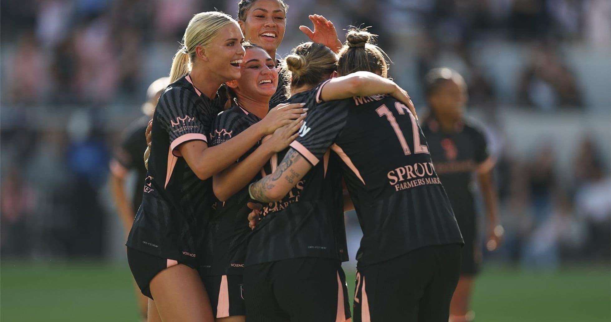 Players celebrating after scoring a goal