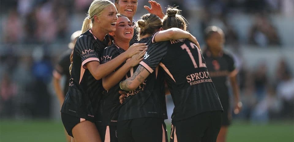 Players celebrating after scoring a goal