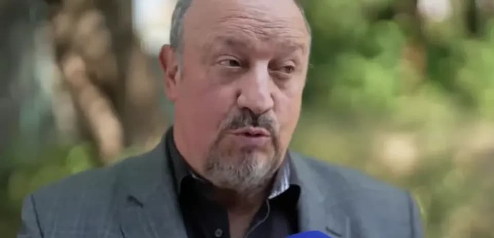 Football manager speaking during outdoor interview