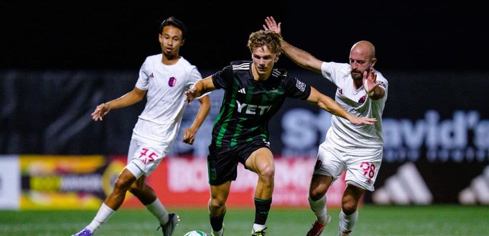 Player dribbling past opponents during match