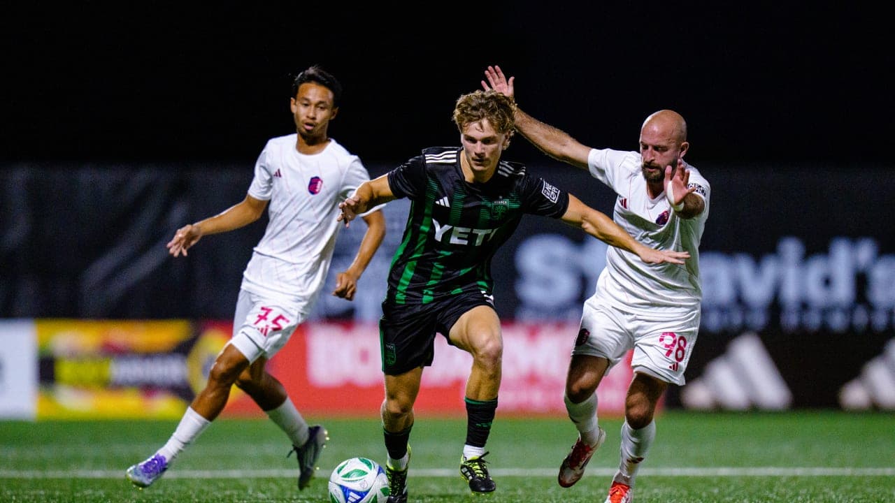 Player dribbling past opponents during match