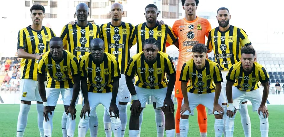 Football team posing for a group photo on field