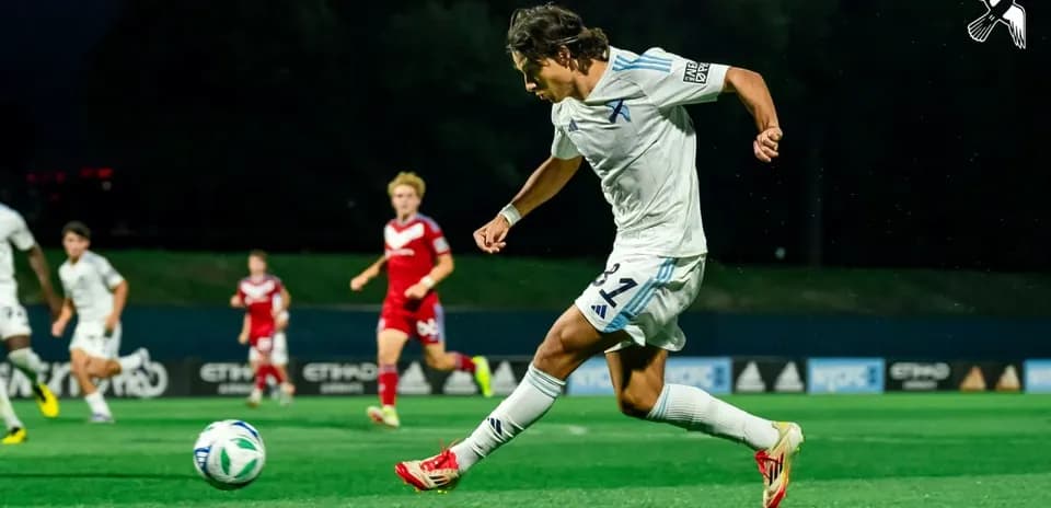 Player kicking the ball during MLS Next Pro match