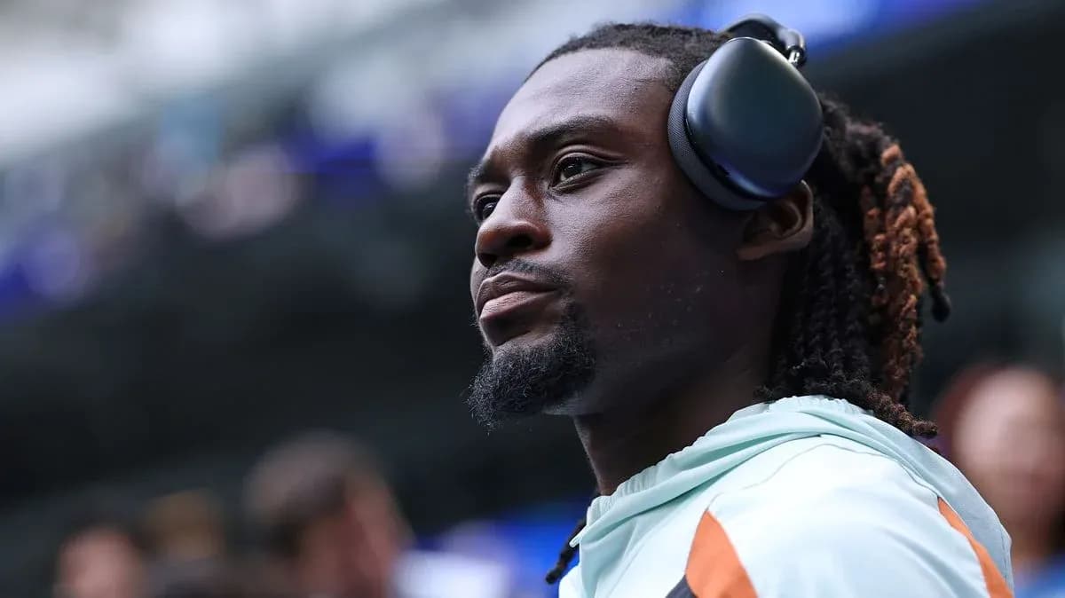 Player wearing headphones on the sidelines