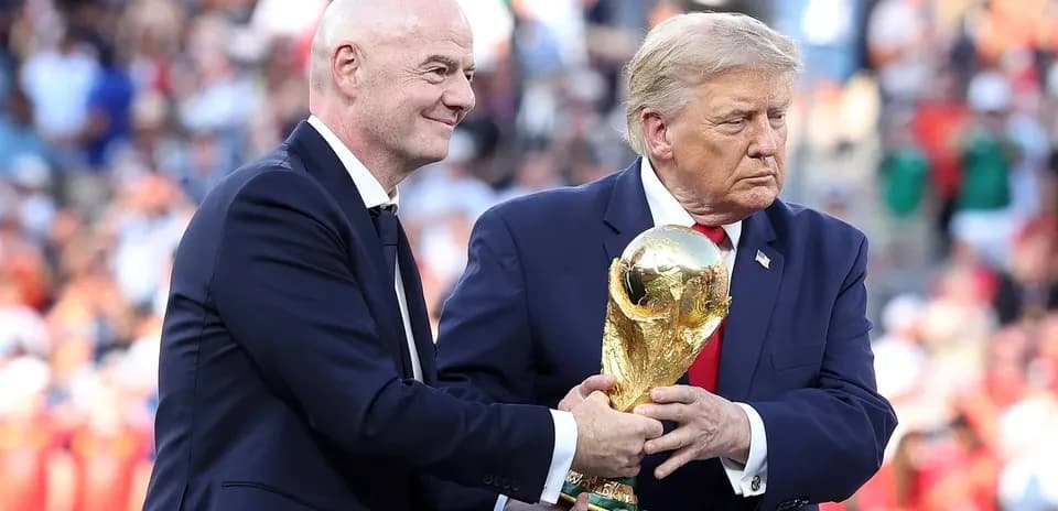 Gianni Infantino handing World Cup trophy to Donald Trump