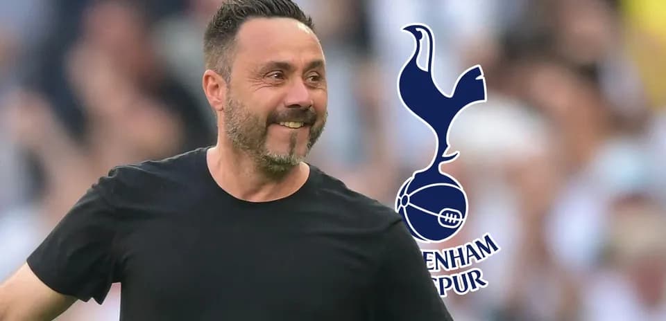 Coach celebrating with Tottenham Hotspur logo in background