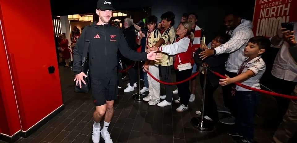 Player greeting fans while entering venue