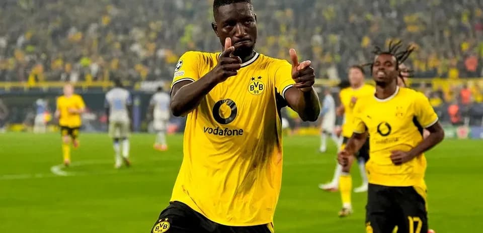 Player celebrating a goal in Borussia Dortmund kit