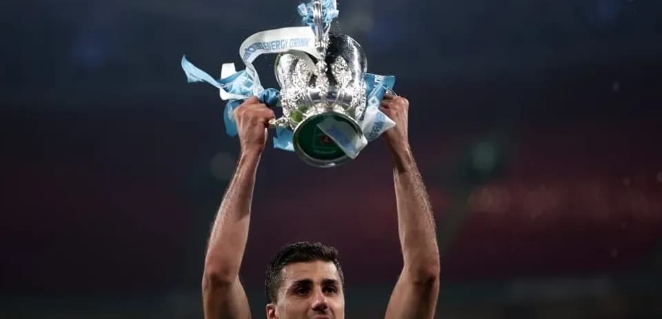 Player holding trophy aloft after winning match