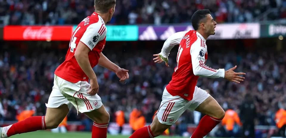 Arsenal players celebrating a goal during match