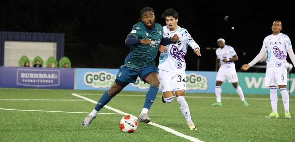 Player dribbling the ball during match action