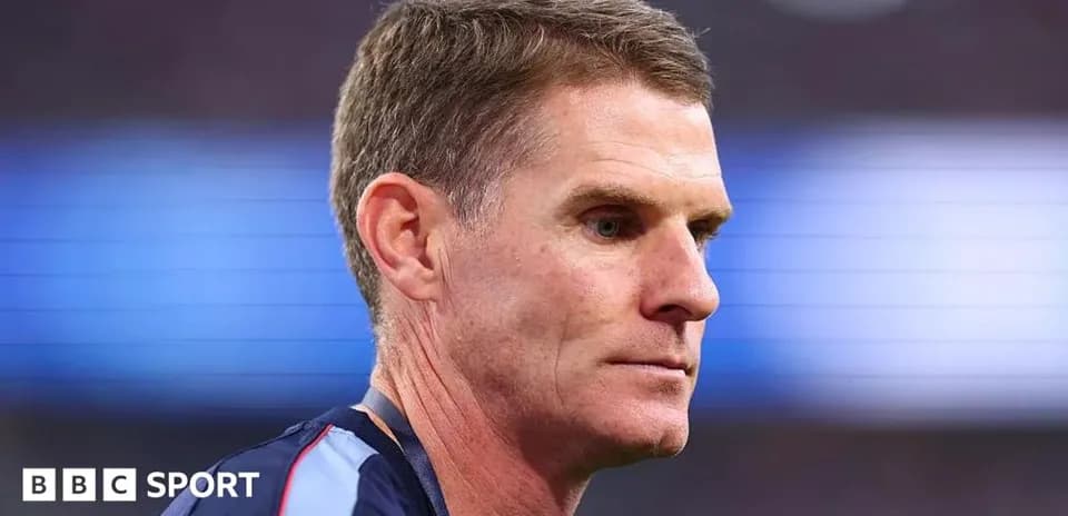 Coach during match preparation on the sidelines