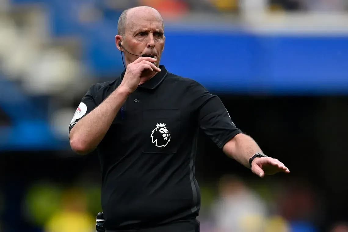 Referee signaling during a Premier League match