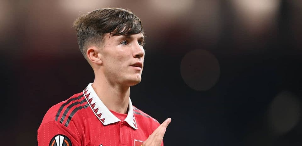 Player in red jersey gesturing during a match