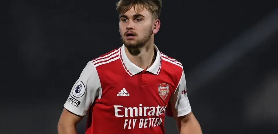 Player in Arsenal kit during match action
