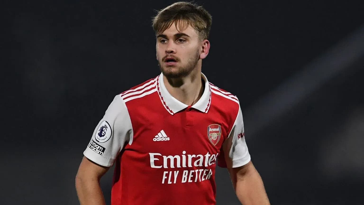 Player in Arsenal kit during match action