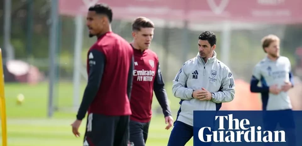 Arsenal players training with coach at practice session