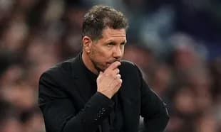 Coach contemplating during a football match