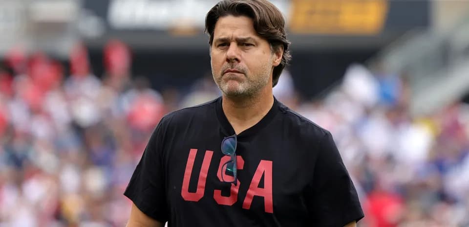 Coach wearing USA shirt on the sidelines