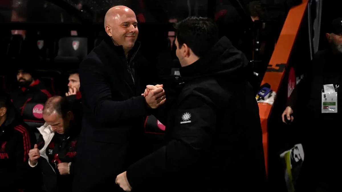 Coaches shaking hands on the sidelines during match
