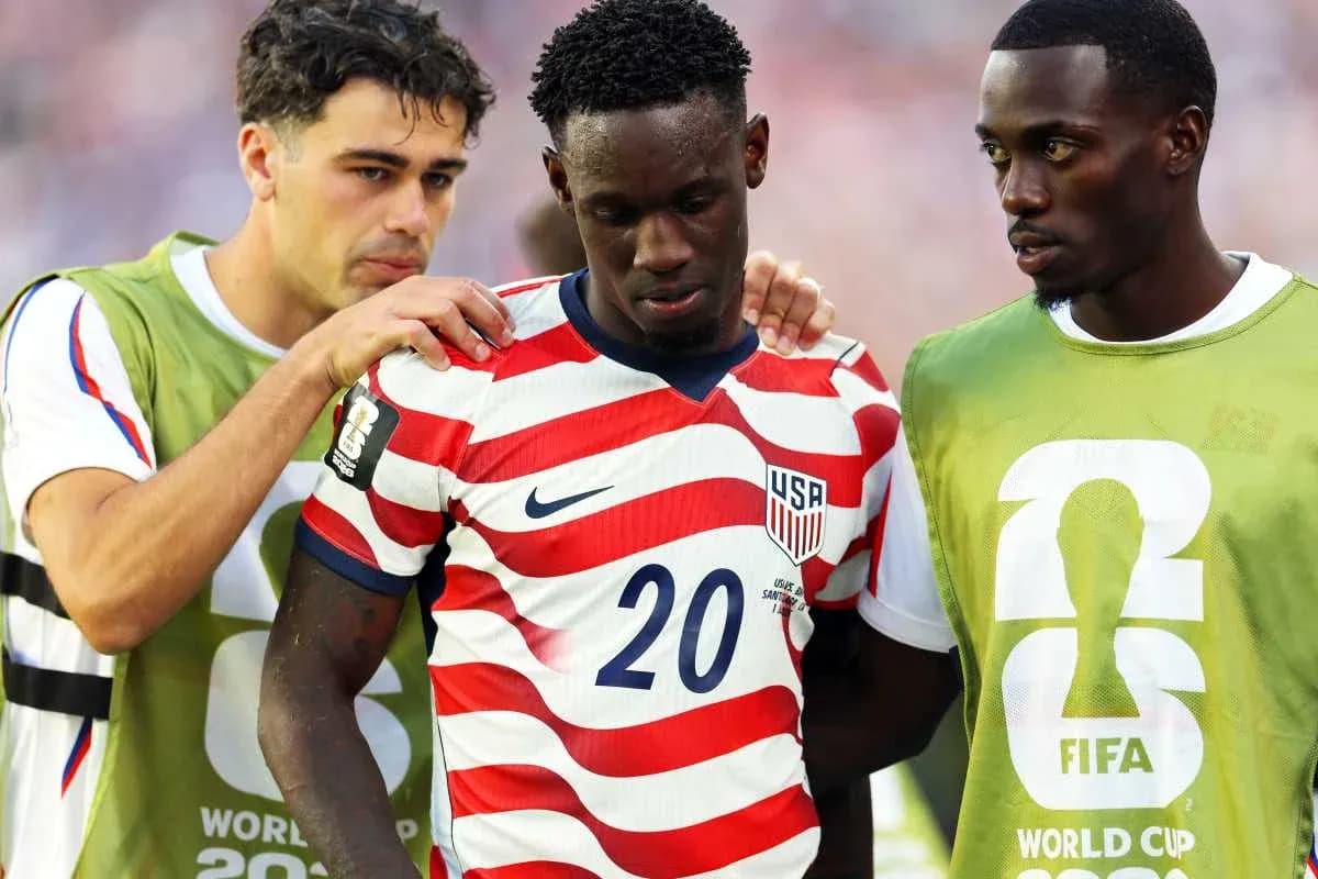 USA players comforting teammate during World Cup match