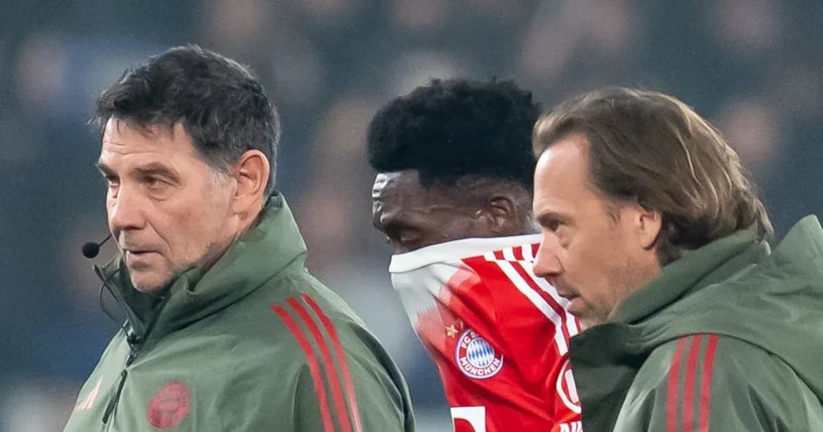 Coaches attending to player during match